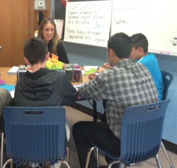 English teacher Andrea DeLotto works with a group of students in the school’s new Read 180 program, which is designed to help ninth-graders enhance their reading skills and bring those skills to grade level. English teacher Casey Duffy is also an instructor in the program.
