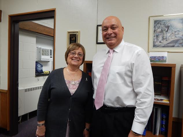 Secretary Pat Schulze smiles alongside Principal Gary Bocaccio at their home base, the central office in Danbury High School. Shulze has served under Bocaccio for a number of years, and plans to retire with him.