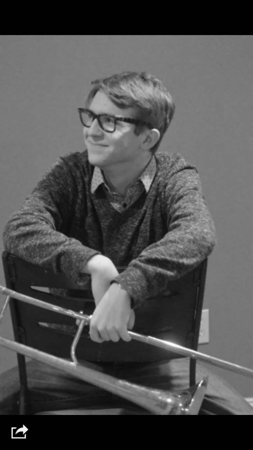 Western Regions second-chair Daniel Koveleski smiles with his trombone. 
