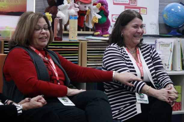 Ada Fernandez McGuire, left, and Nydia Goyares, right, speak to Mrs. Mittens Early Childhood Workshop class. 