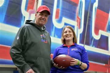 Kathryn Smith stands next to Bills head coach Rex Ryan 