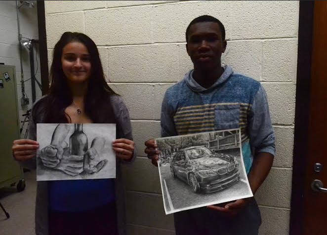 Bartley and Sakosky with current pieces they are working on in AP Studio Art.