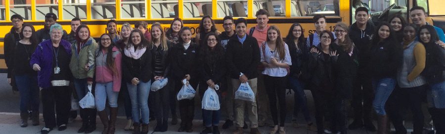 AP Literature students pose in front of their school bus after seeing the play, The Piano Lesson by August Wilson.