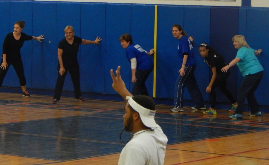 The team of guidance counselors and students get set on their marks in Peer Leaderships Dodgeball for Africa Tournament. Peer Leaders organized the tournament to raise money for UNICEF, earmarked for Africa. The team representing the wrestling squad won the tourney, which raised $600.