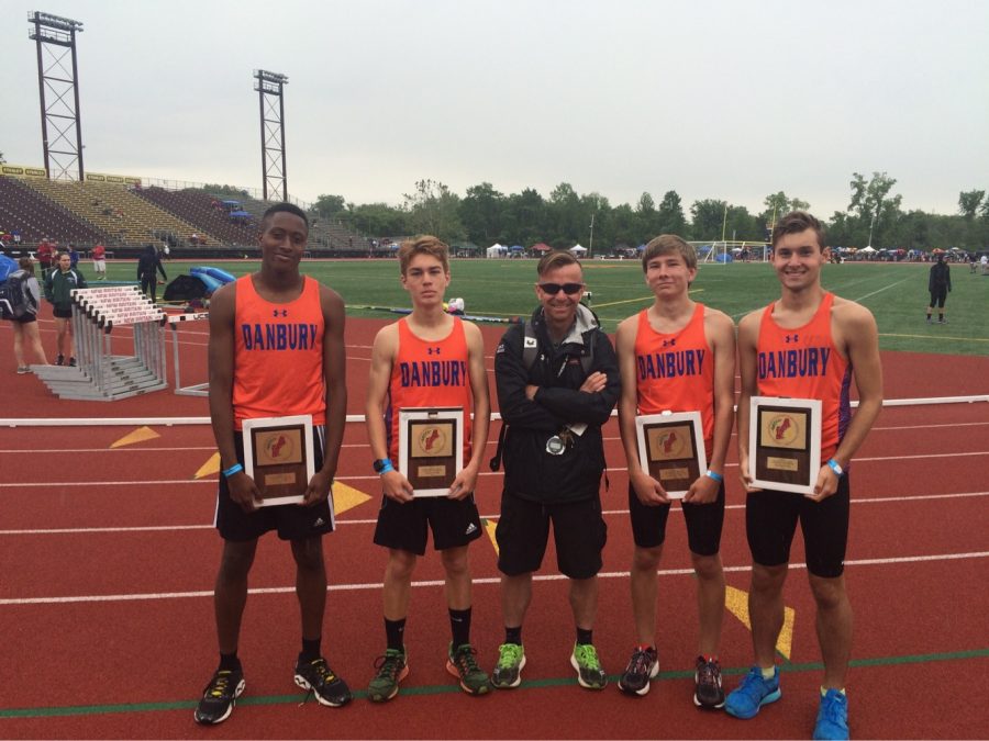 Coach Rob Murray stands with four of his winning athletes from a previous season. From left, Terrell Cunningham, Jack Adamski, Murray, Tim Moore and Jake Roberts