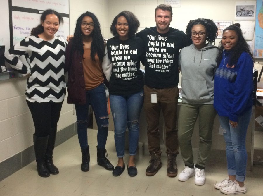 From left to right: Anna Adebambo (12), Joy-Anne Foster (12), Ashley Layton (12), Julian Shafer, Tyra Hodge (12) and Aaliyah Jeffries (12), all founders of the new club.