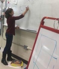 Fifth-grader Jennifer Assis, granddaughter of Linda Mitten, teaches high schoolers how to approach Common Core mathematics.