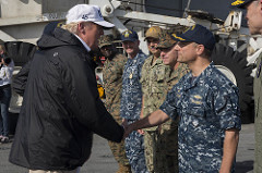 President Trump shakes hand with the captain of USS Kearsarge in the Caribbean Sea to discuss relief operations in Puerto Rico post Hurricane Maria. 