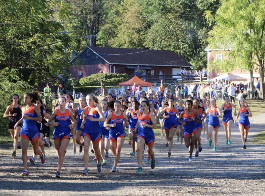 Here, the team runs in a pack during a competition at Tarrywile. But when practicing, the team runs on city streets and sidewalks and is often subjected to catcalling. 