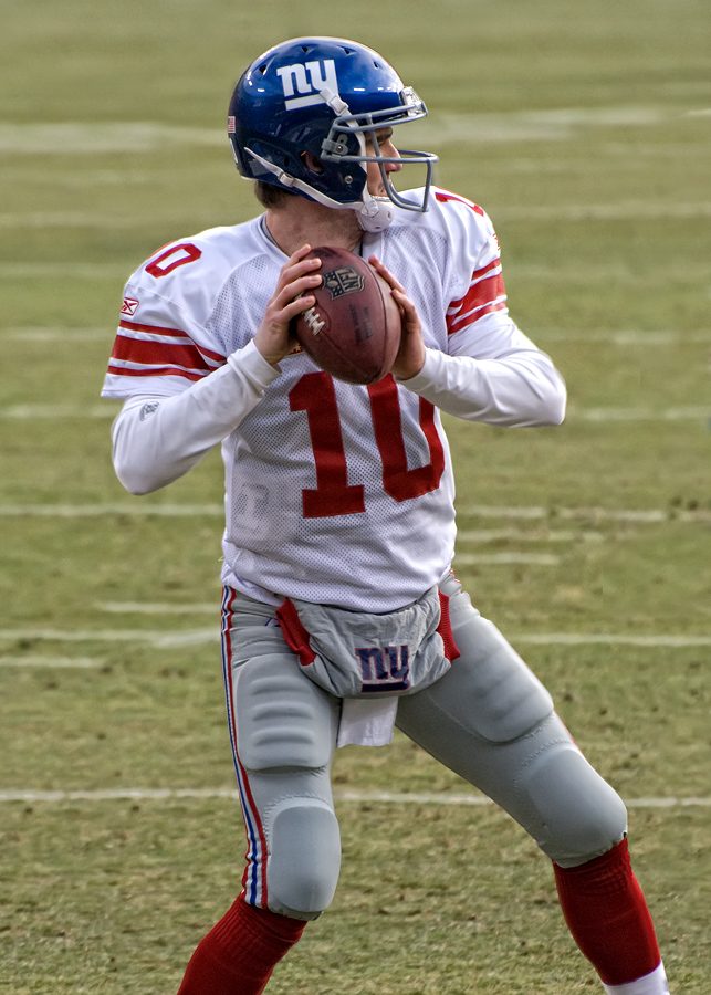 Eli Manning preparing to throw the ball to his wide receiver against the Green Bay Packers