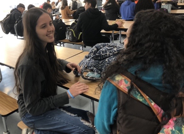 Liz Rivera talks to her new friend from DHS during lunch.