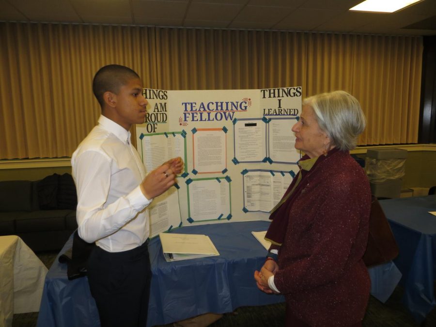 Nelson Neira presents his poster to Patricia Ivry, interim dean for the
School of Professional Studies at Western Connecticut State University.
