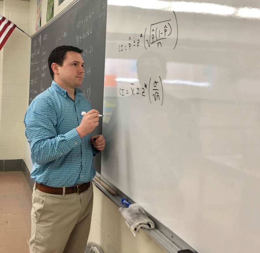 James Tong goes over two equations for his statistics class.