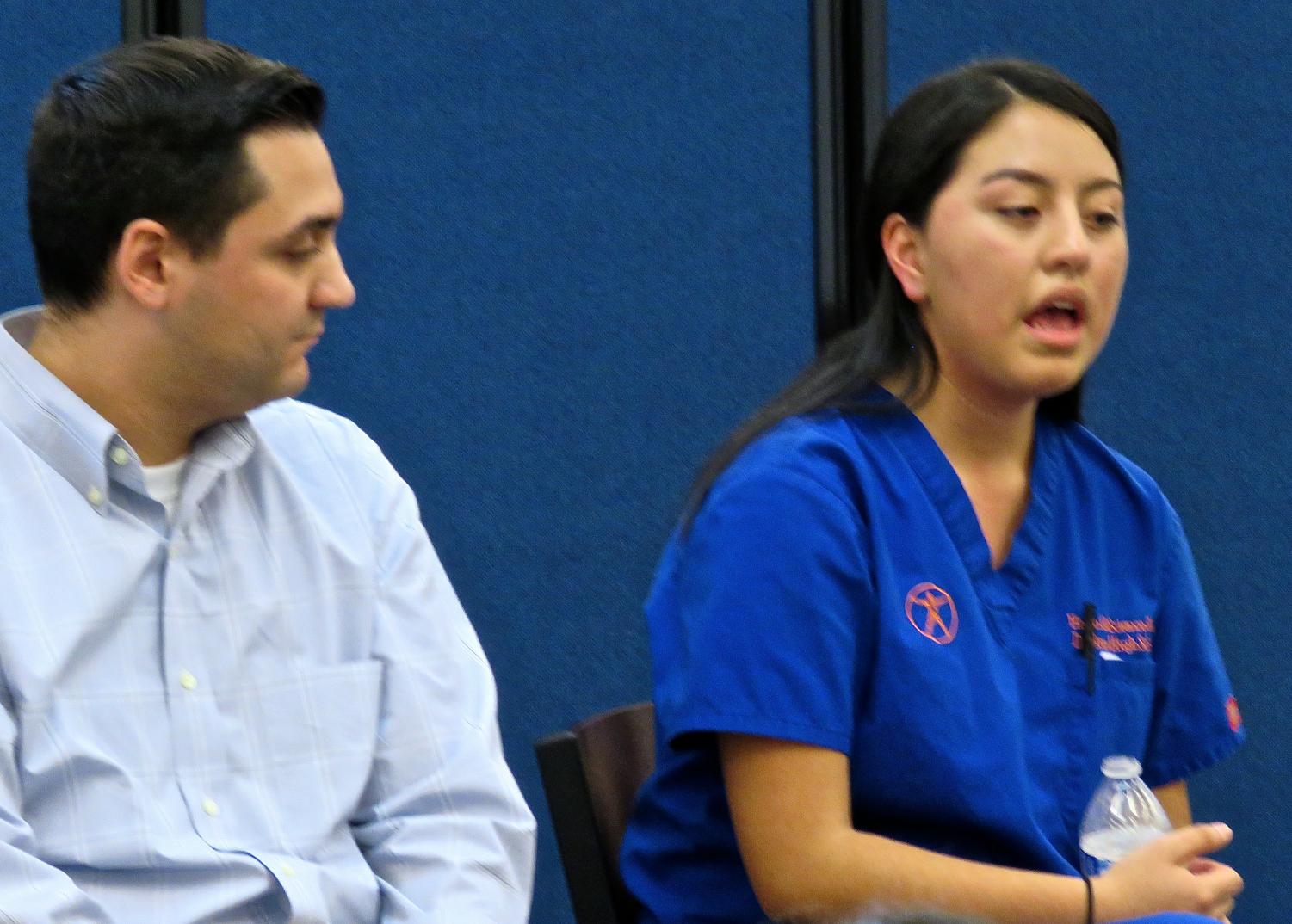 State Rep. Michael Ferguson, a DHS graduate, listens as junior Denise Rodas tells of her dream to go to college in a forum Friday in the Library Learning Commons.