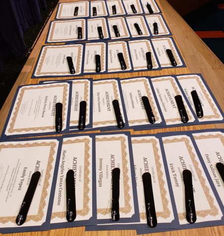 Certificates and gifts laid out before the presentation honoring ESL students who prepared and sat for the AP Spanish Language and Culture exam as an independent study.