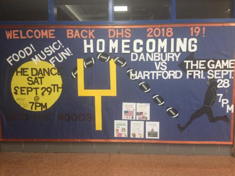 The bulletin board in the main entrance describes each day of spirit week.