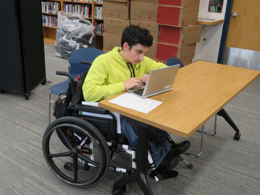 Sophomore Austin Harrighi completing independent classwork in the library after the elevator complications.