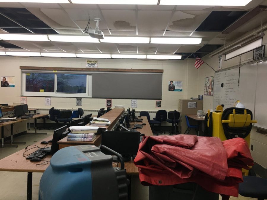Equipment to get rid of water stands in Diane Mohs room, which was deluged with water after a pipe break Tuesday afternoon.