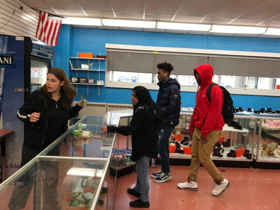 Senior Angelyna Custodio works the counter at the school store, helping customers get their snacks and drinks. The store remains one of the more popular destinations for students throughout the school day.