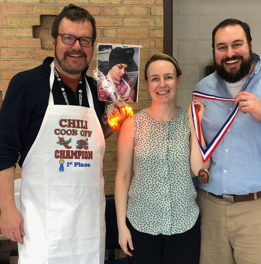 The Sophomore Class held its annual Chili Cook-off on Feb. 22.  Dave Honeyford, left, won Best Overall, Megan Hughes (Honeyford is holding a photo of her) won Spiciest, and Elise Tobin and Devin Samaha won Most Unique.
