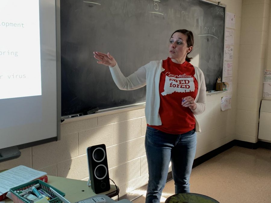 Lindsey Stoffa, psychology teacher, wears the Red for Ed t-shirt on Wednesday, March 20, in support of NEA-Danburys school budget campaign. Stoffa is also the unions co-chair of its Teacher Evaluation Committee.