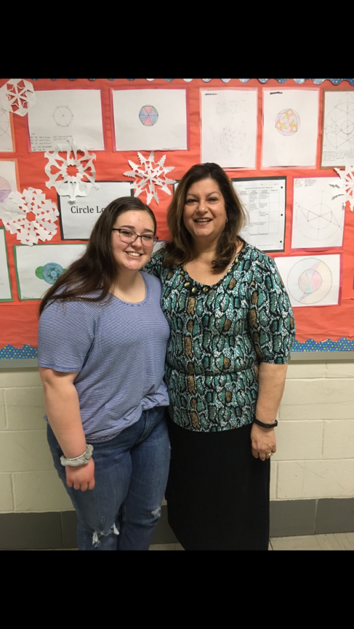 Salutatorian Ashley Schlemmer stands with math teacher Marlene Caravakis. Carvakis has served as a mentor to Schlemmer and knows she will succeed in every aspect of her life due to her exceptional work ethic.