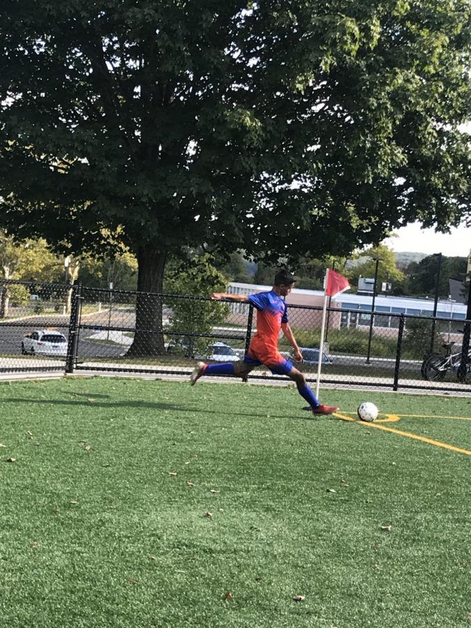 Victor Oliveira takes a corner kick for the Hatters against Darien on Friday  Sep. 13