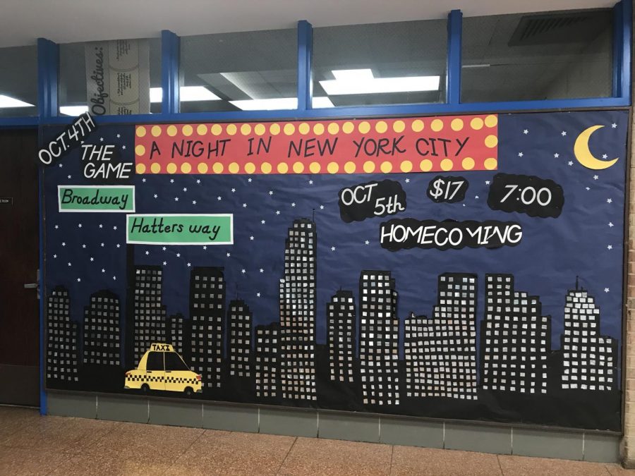 DHS puts up bulletin board to promote the 2019 Homecoming Dance.