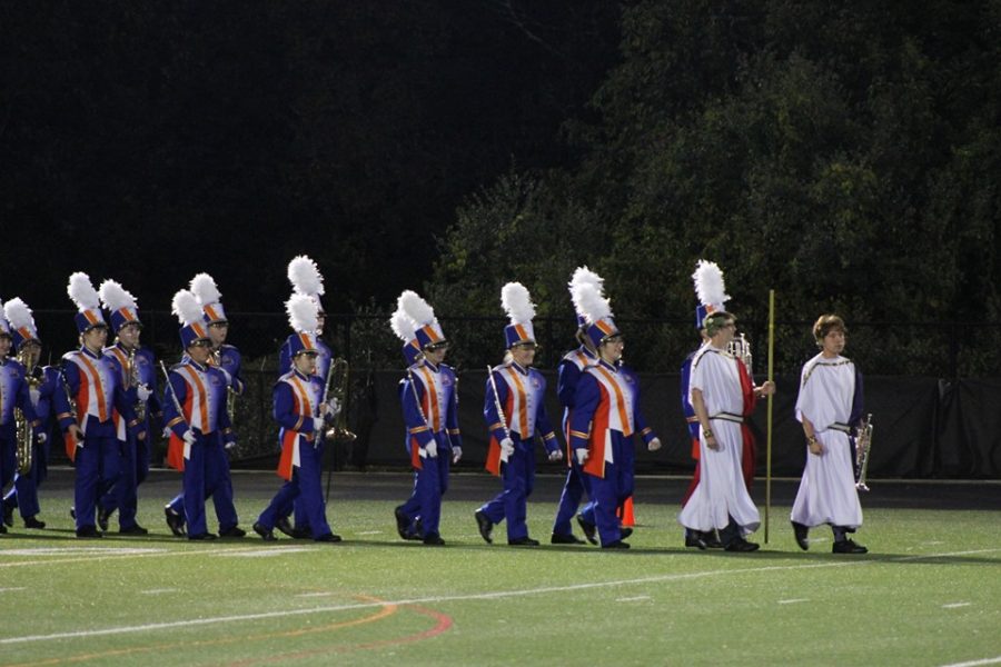 DHS Marching Band, led by Drum Majors Matthew Henry and Luke Lefflbine (far right), perform at halftime during the Homecoming game (Oct. 4). 