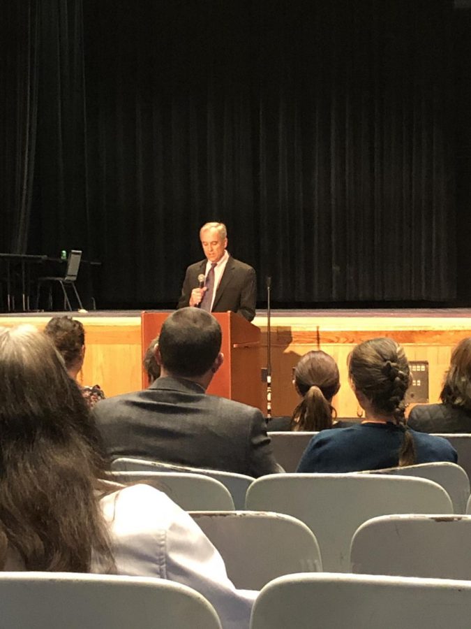 NEASC Committee member Scott Leslie gives initial recommendations to the DHS staff on Wednesday, Nov. 20 during concluding ceremonies.