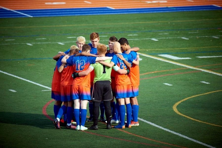 Danbury boys huddle together during states game.