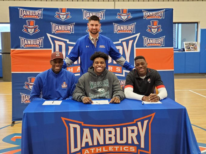 (L-R) Jah Joyner, Kile Jackson, Pierre Moudourou and (Top Row) Coach Augie Tieri during the Hatters football signing day at Danbury HS on 12/18/19