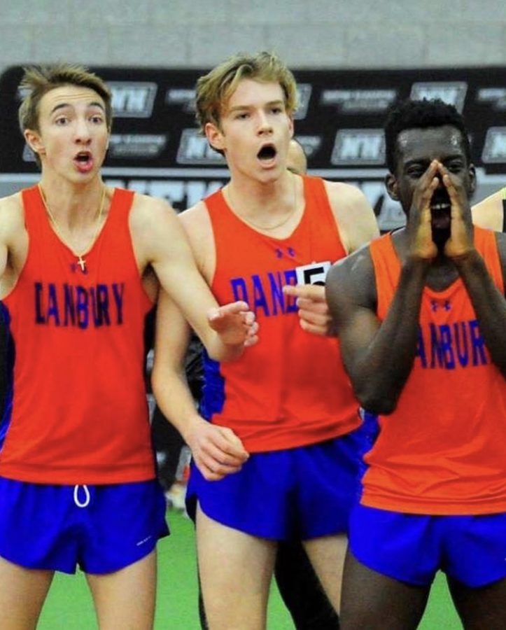 Senior Jack Watson(left), Senior Dylan Rosemark(middle), Junior Glenn Addotey(right), cheer on teammates during the Class LL Divisional Championships at the Floyd Little Athletic Center on Feb. 13