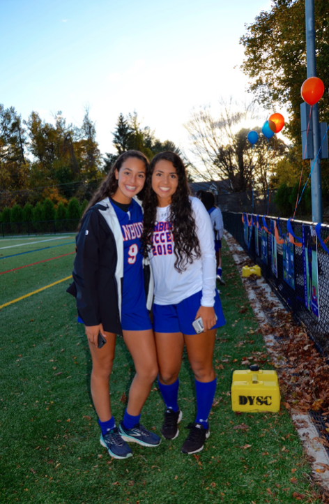 Jessica and Stephanie Queiroz during senior night at girl’s soccer game
