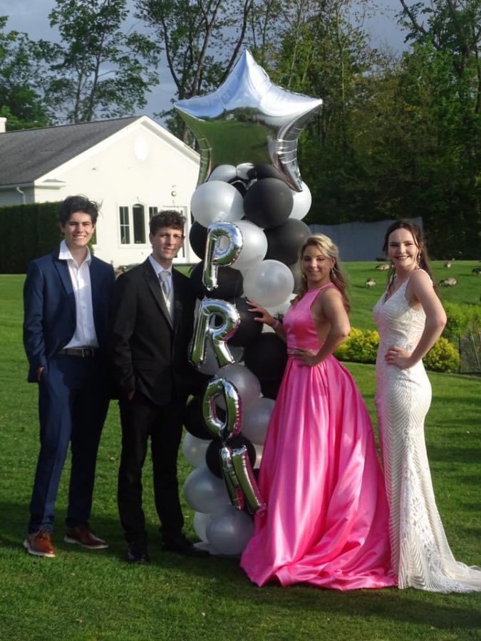 Students pose for their at-home 2020 senior prom.