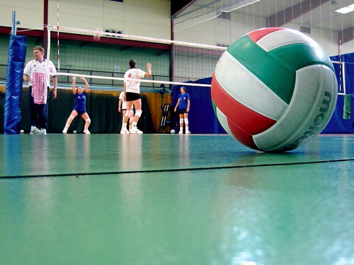 volleyball being played in a gym