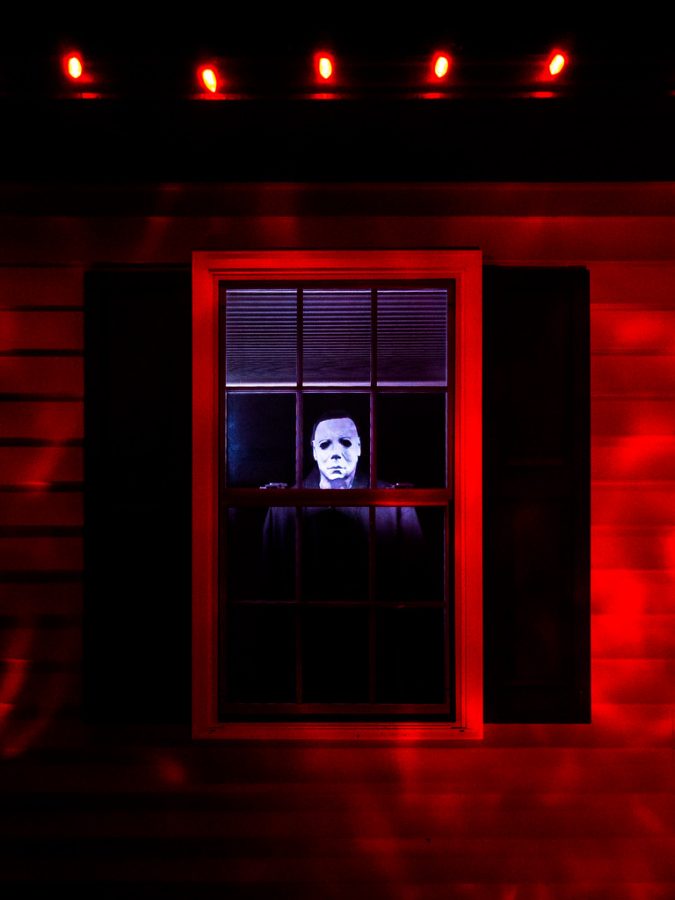 Michael Myers staring out the window looking for other victims