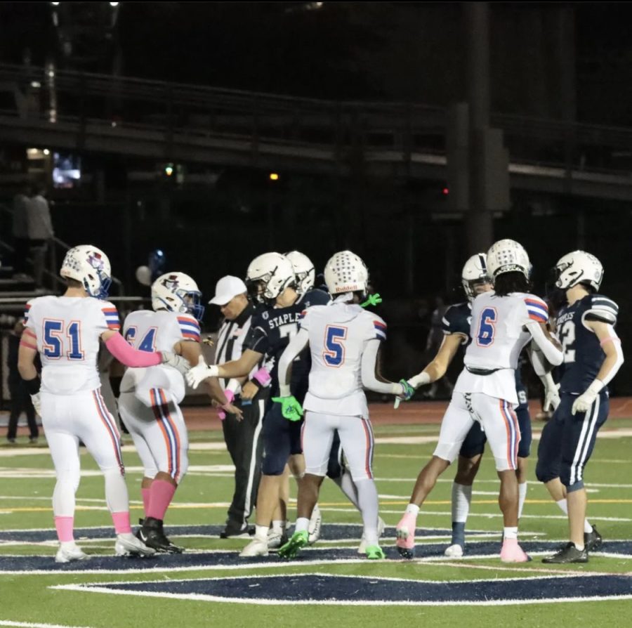 Danbury and Staples captains meet at midfield before the game. Photo creds to:  @mg_sport_photography