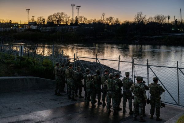Texas National Guard soldiers stand guard on the banks of the Rio Grande at Shelby Park in Eagle Pass, Texas, on January 12